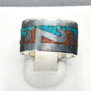 A Navajo Sterling Silver band ring with Coral and Turquoise chips